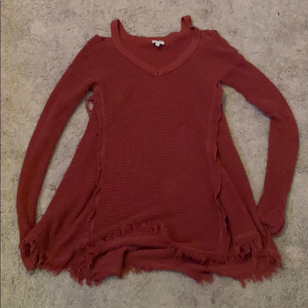 a long sleeve maroon color sweater